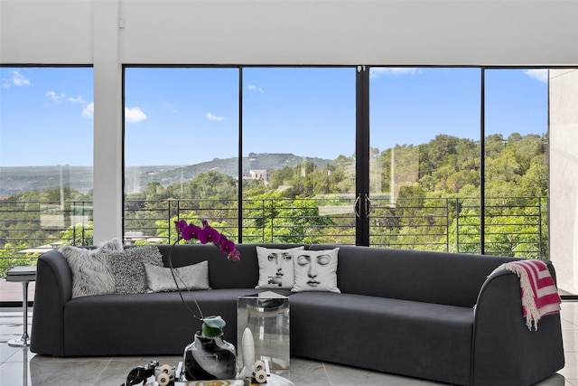 sunroom / solarium featuring a mountain view