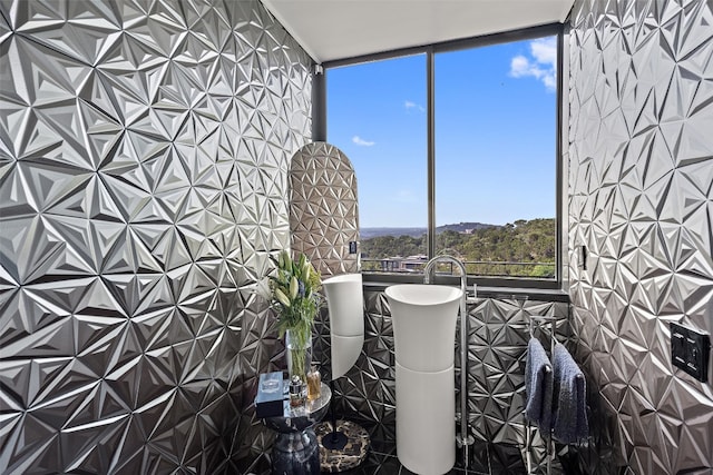 bathroom with tile walls