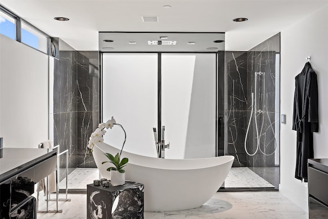 bathroom with tile patterned flooring, vanity, and separate shower and tub