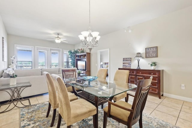 1000 The Cape Rd Unit 24, Horseshoe Bay, TX 78657 - dining room with light tile patterned flooring, a ceiling fan, and a chandelier