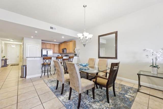 1000 The Cape Rd Unit 24, Horseshoe Bay, TX 78657 - dining room featuring light tile patterned floors, a chandelier, and recessed lighting
