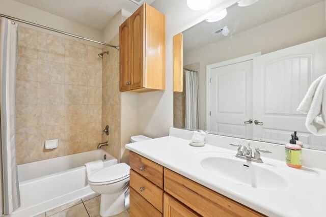 1000 The Cape Rd Unit 24, Horseshoe Bay, TX 78657 - bathroom featuring vanity, tile patterned flooring, and shower / tub combo with curtain