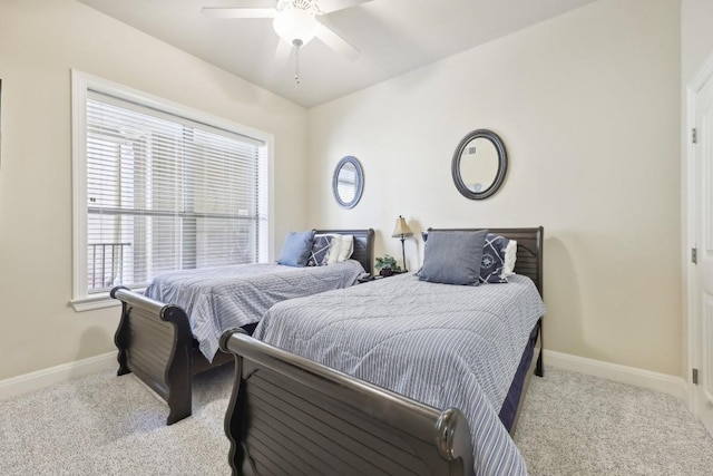 bedroom featuring ceiling fan and light colored carpet