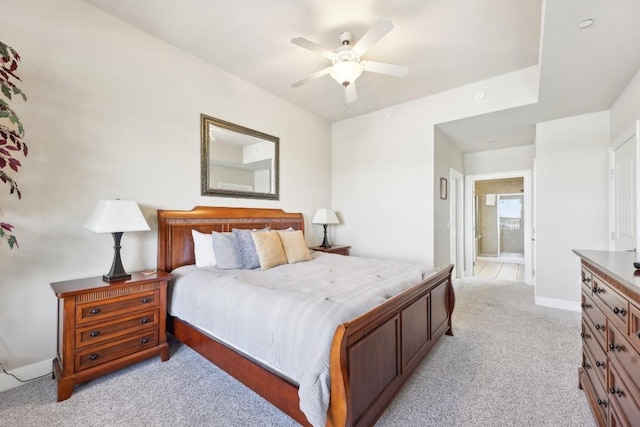 1000 The Cape Rd Unit 24, Horseshoe Bay, TX 78657 - bedroom featuring light carpet, ensuite bathroom, and ceiling fan