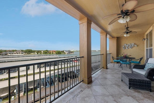 1000 The Cape Rd Unit 24, Horseshoe Bay, TX 78657 - balcony featuring a ceiling fan and a water view