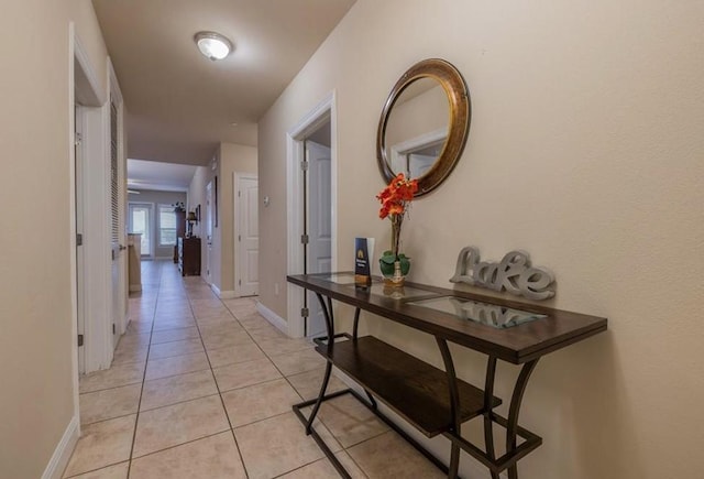 hallway featuring light tile patterned floors