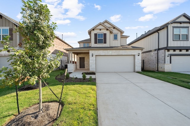 view of front of property with a garage and a front lawn