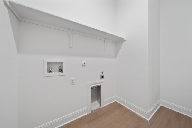 laundry room with washer hookup, electric dryer hookup, gas dryer hookup, and wood-type flooring