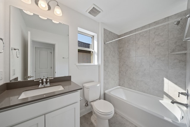 full bathroom with vanity, toilet, and tiled shower / bath