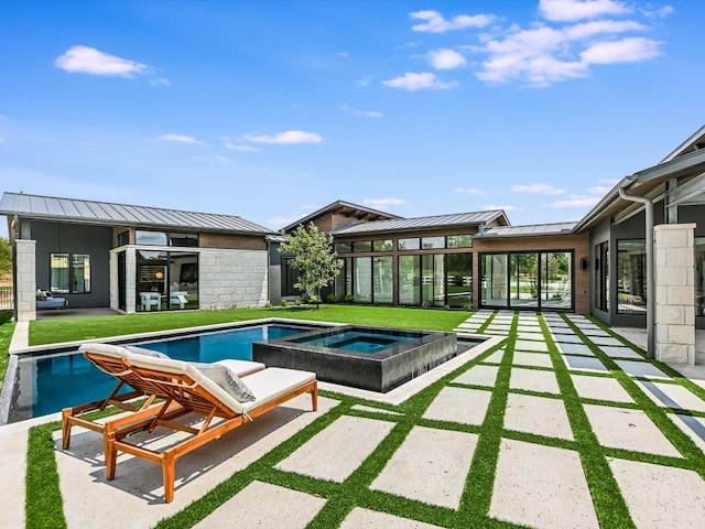 view of pool featuring an in ground hot tub and a patio area