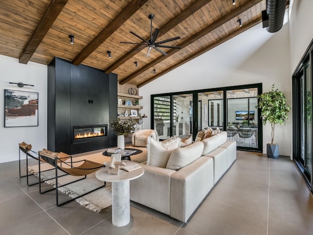 living room featuring beamed ceiling, a fireplace, and high vaulted ceiling