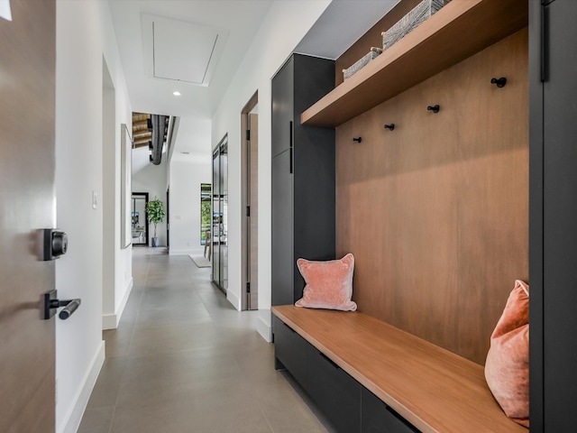 mudroom with light tile patterned floors