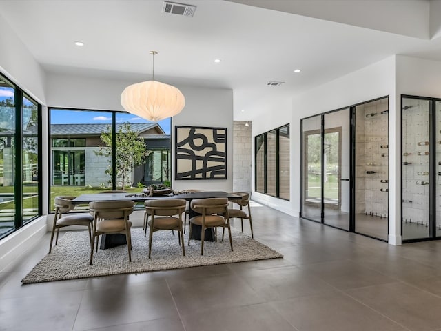 dining room featuring a healthy amount of sunlight and tile patterned flooring