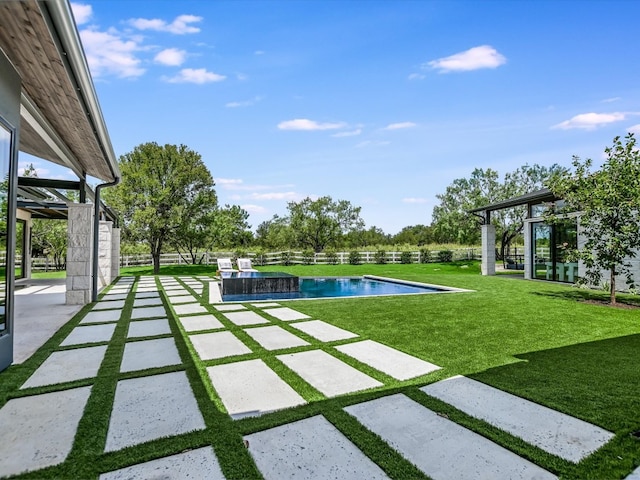 view of pool featuring a patio area and a lawn