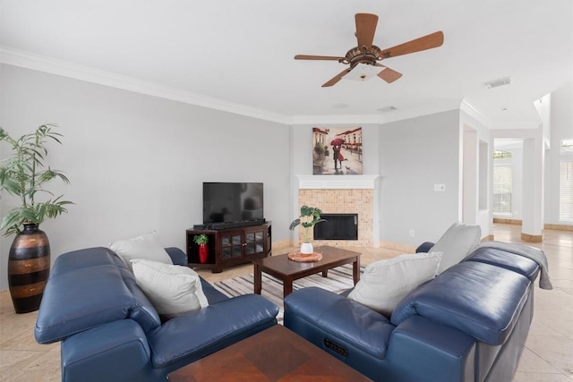 living room featuring light tile patterned floors, crown molding, and ceiling fan