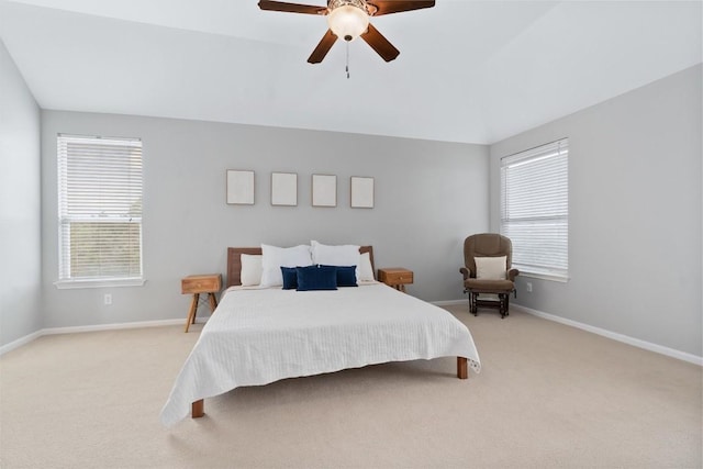 carpeted bedroom featuring vaulted ceiling and ceiling fan