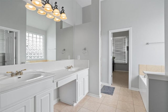 bathroom featuring lofted ceiling, a tub to relax in, tile patterned flooring, vanity, and an inviting chandelier