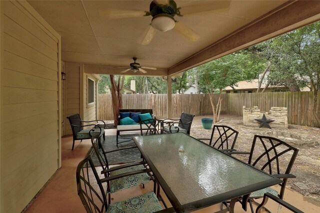 view of patio featuring an outdoor hangout area and ceiling fan