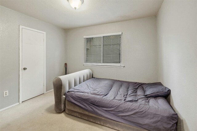 bedroom with light carpet