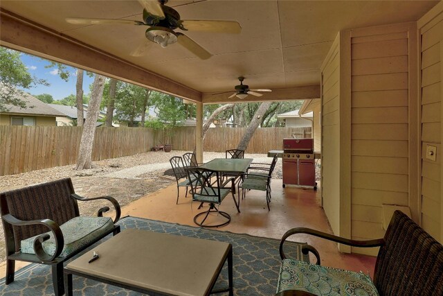 view of patio featuring ceiling fan