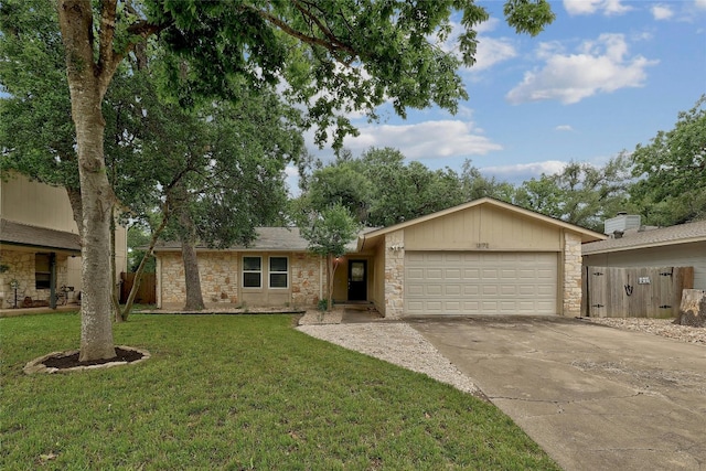 ranch-style home featuring a garage and a front lawn