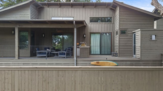 rear view of house with a porch