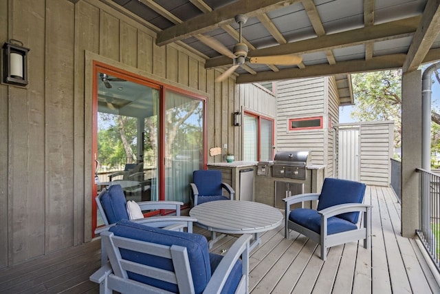 wooden deck with ceiling fan and a grill