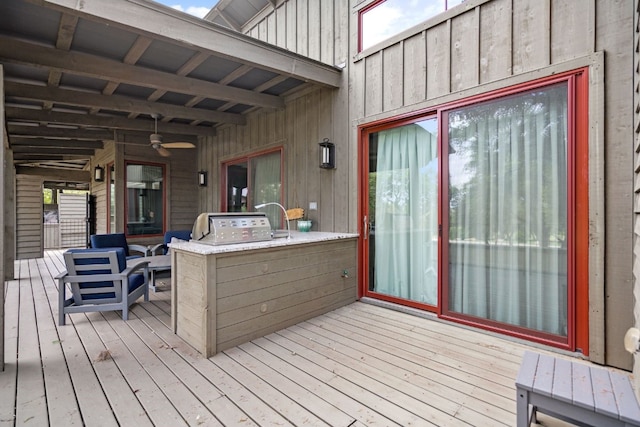 wooden deck featuring ceiling fan