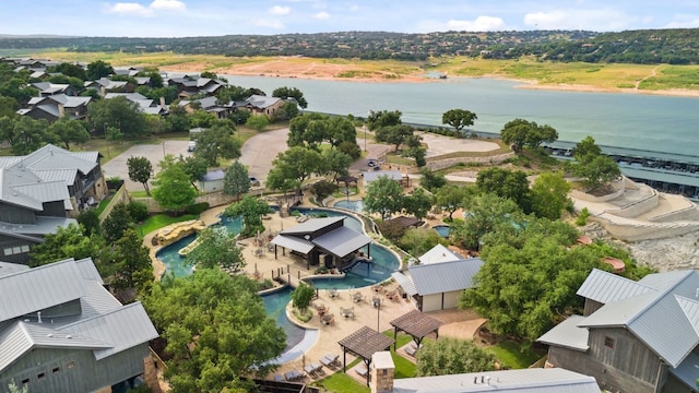 birds eye view of property with a water view