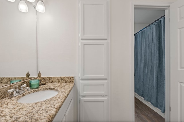 bathroom featuring vanity and hardwood / wood-style floors