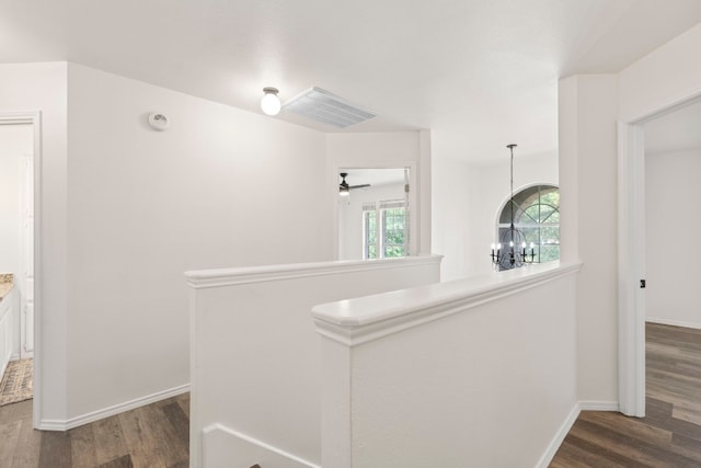 corridor with dark hardwood / wood-style floors