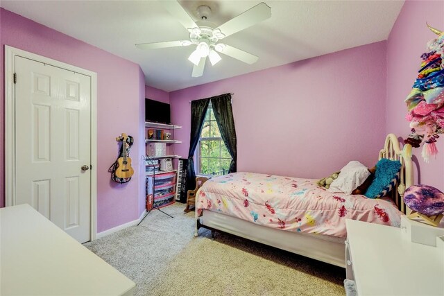 bedroom featuring ceiling fan and light colored carpet