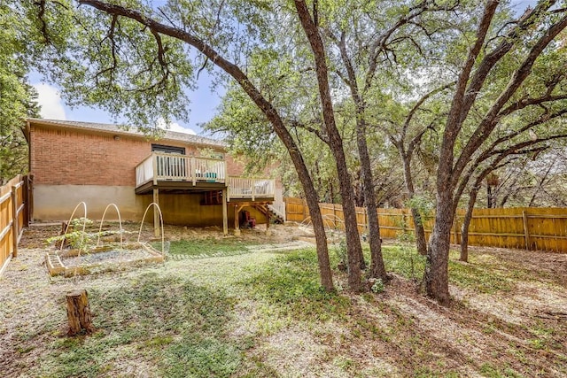 view of yard with a wooden deck