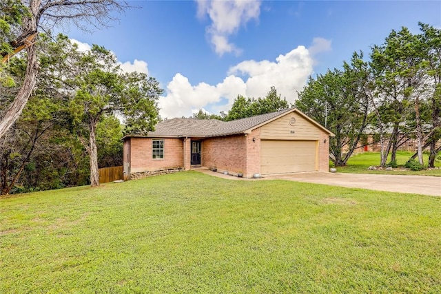 ranch-style house featuring a garage and a front yard