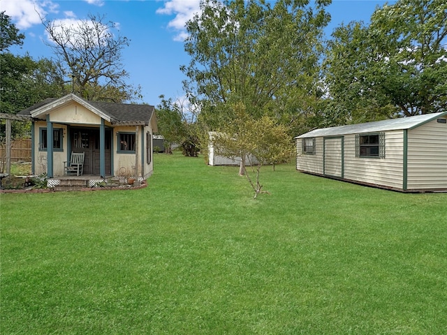 view of yard featuring a porch and a shed