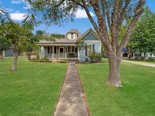 cape cod house with a porch and a front lawn