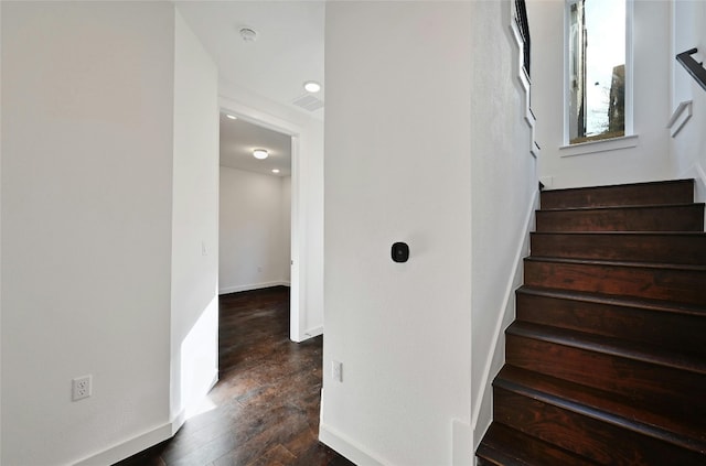 stairs featuring wood-type flooring