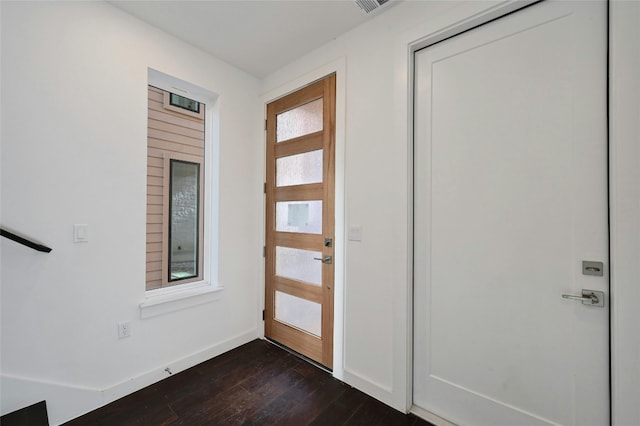 entryway with baseboards and dark wood-style floors