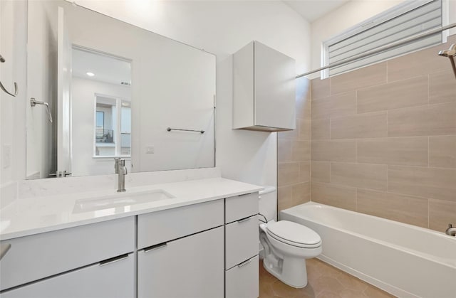 full bathroom featuring vanity, washtub / shower combination, tile patterned floors, and toilet