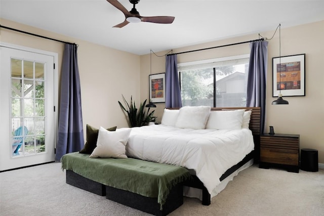 bedroom featuring light carpet, a ceiling fan, and access to exterior