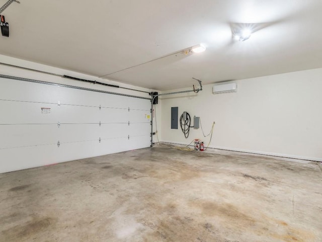 garage featuring a wall unit AC and electric panel