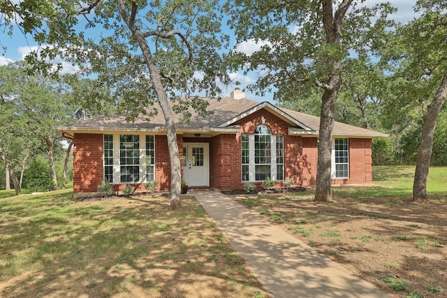 single story home featuring a front yard