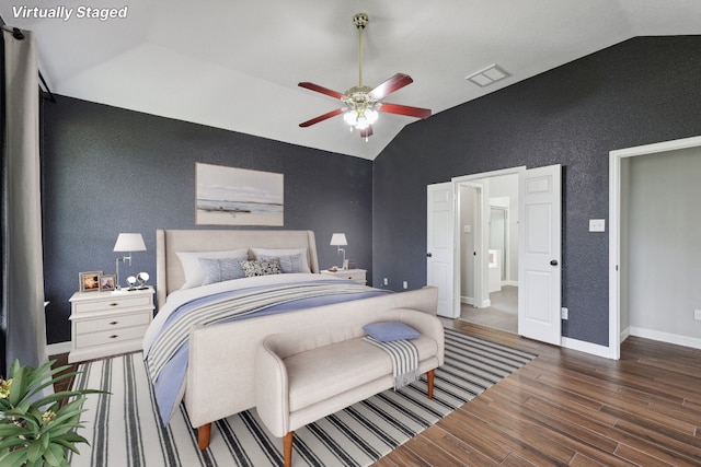 bedroom featuring hardwood / wood-style flooring, vaulted ceiling, and ceiling fan