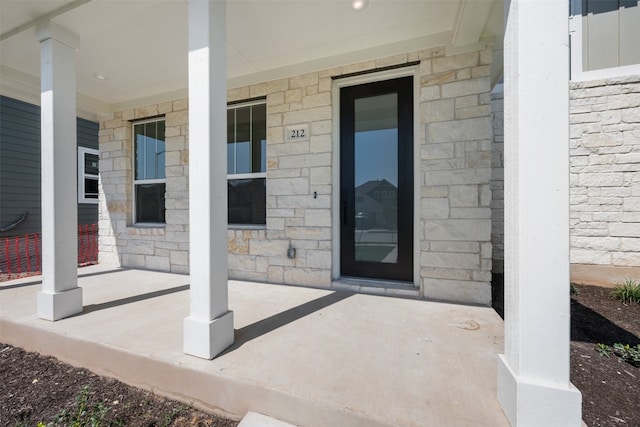 doorway to property featuring a porch