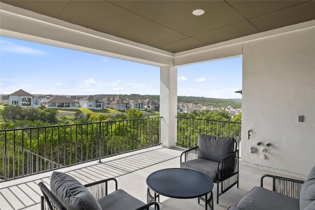 view of patio / terrace with a balcony and an outdoor hangout area