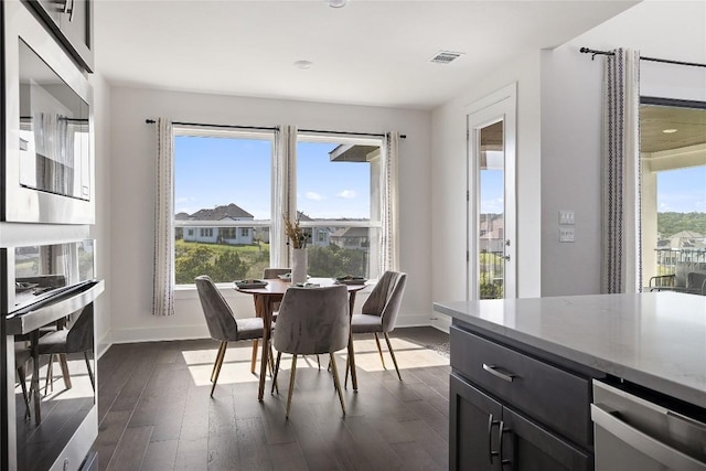 dining area featuring dark hardwood / wood-style flooring