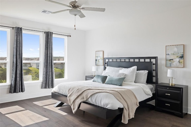 bedroom with dark wood-type flooring and ceiling fan