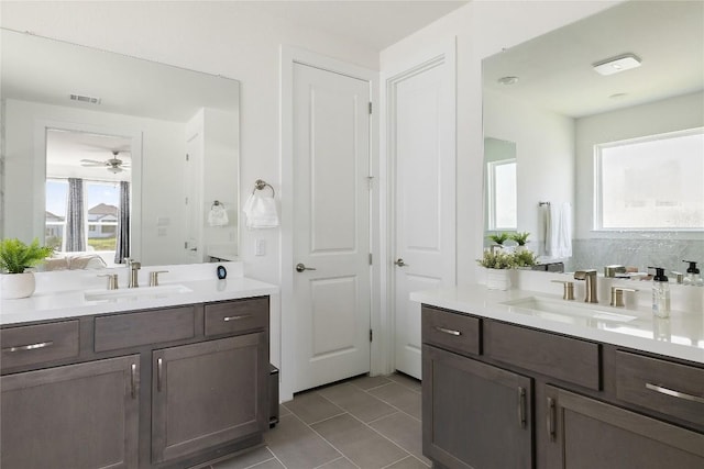 bathroom featuring ceiling fan, tile patterned floors, and vanity