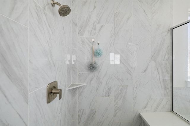 interior space with a tile shower