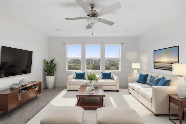 living room with light colored carpet and ceiling fan